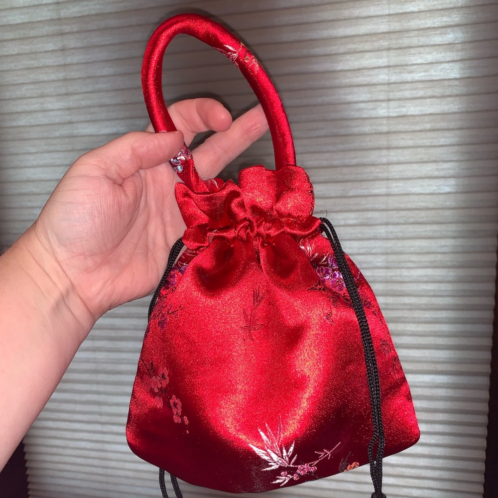 Red satin drawstring hand bag